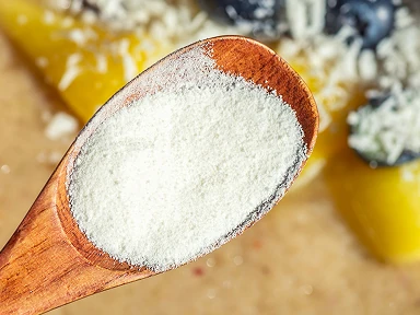 Marine collagen in powder form on a wooden spoon, a highly absorbable component of Roanga ATU providing essential building blocks for strength and elasticity of skin, cartilage, and connective tissues