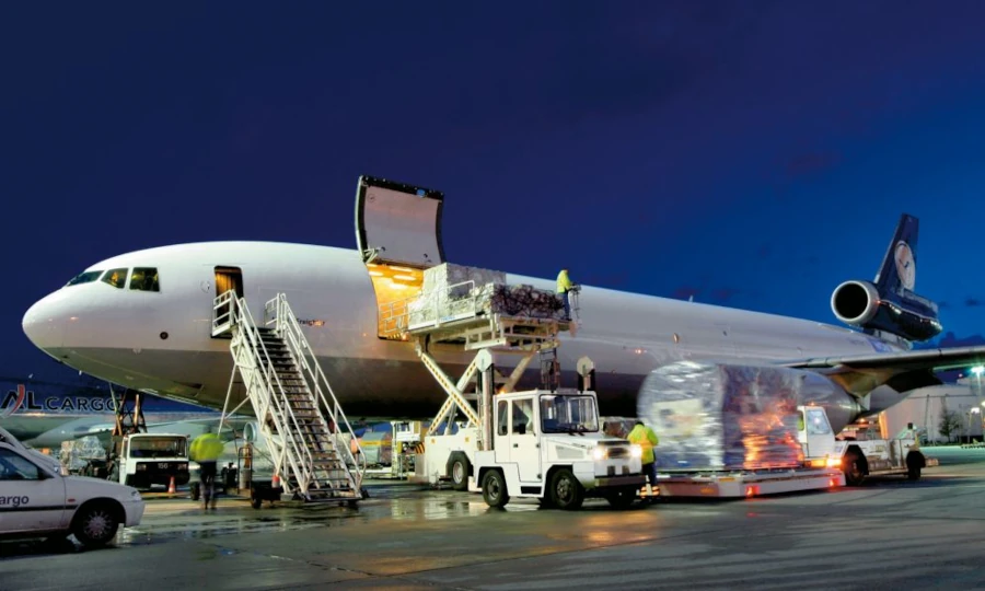 Cargo aircraft during loading, depicting global distribution of premium deer velvet products from New Zealand to worldwide markets